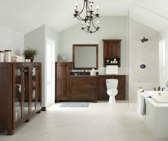 white bathroom with natural wood cabinetry